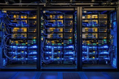 High-tech server room with rows of glowing blue data servers, symbolizing advanced technology and digital infrastructure.