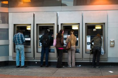 People in ATM from the back